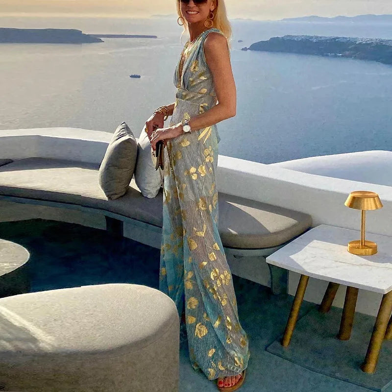 Long flowing dress with V-neckline and details with shiny elements