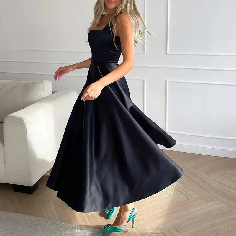 Elegant midi evening dress with straps and full skirt