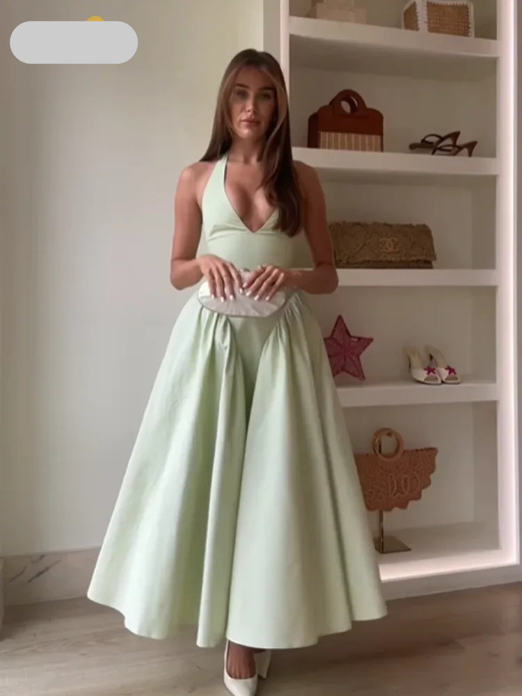Sleeveless dress with a V-neckline and an open back design