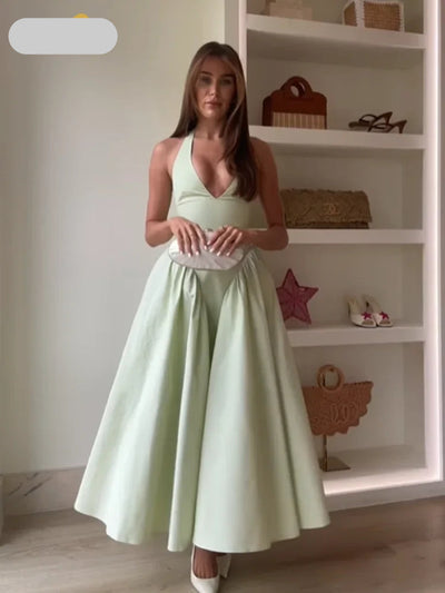 Sleeveless dress with a V-neckline and an open back design