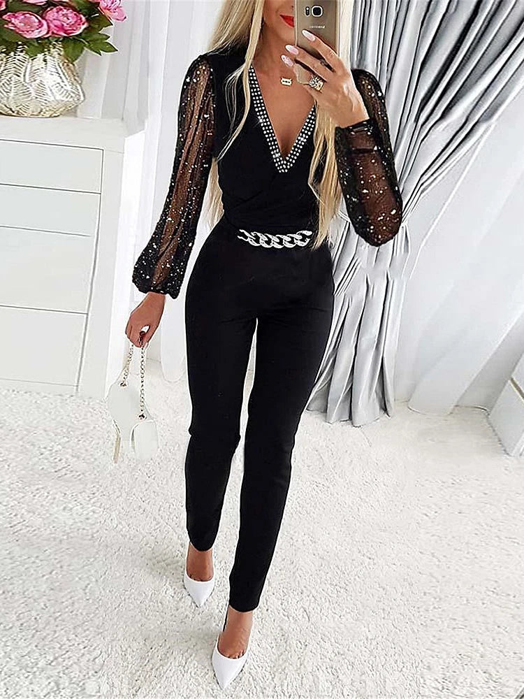 Elegant women's jumpsuit with sophisticated design and shiny sleeves