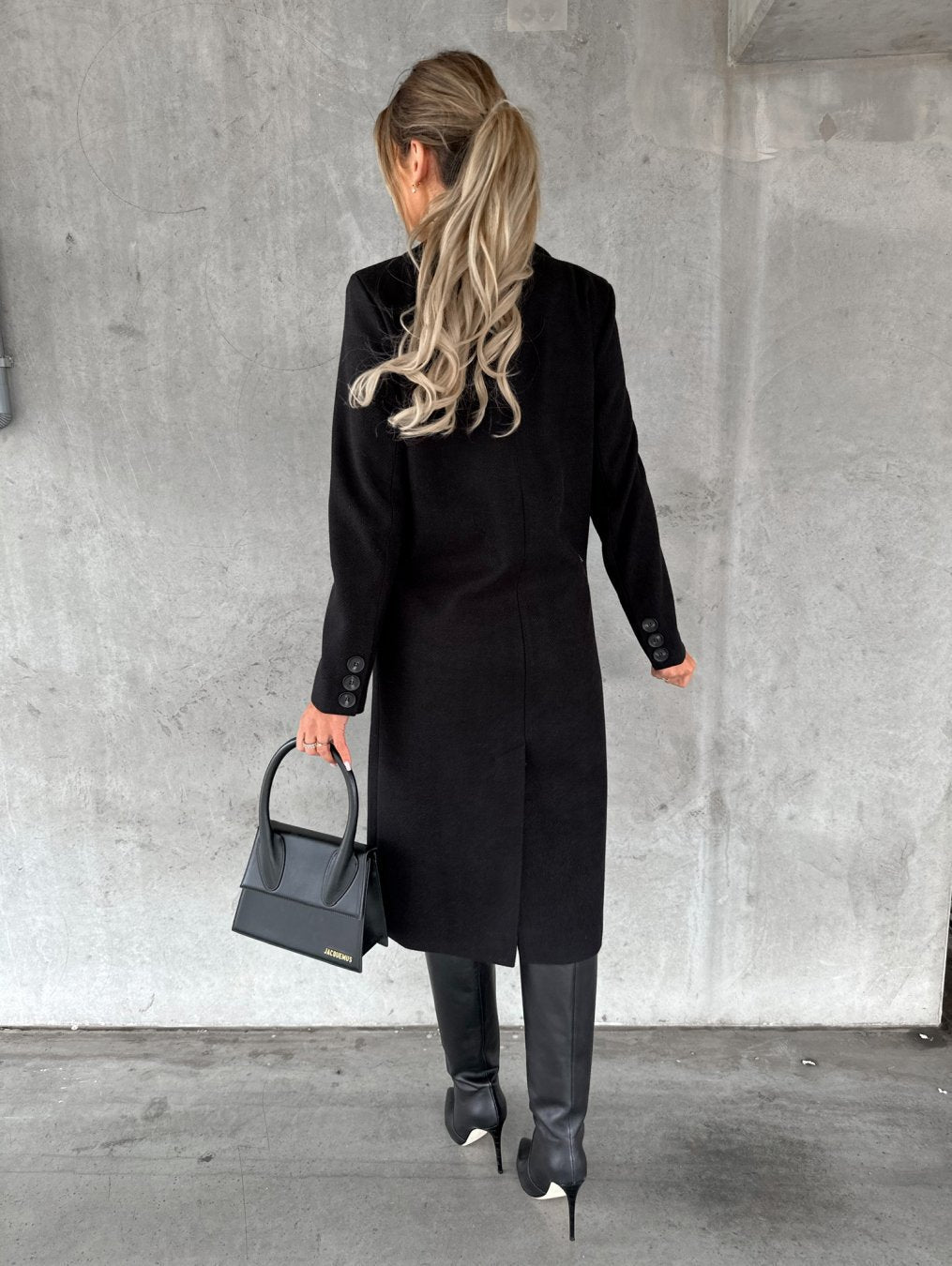 Classic women's long coat with elegant buttons and lapels