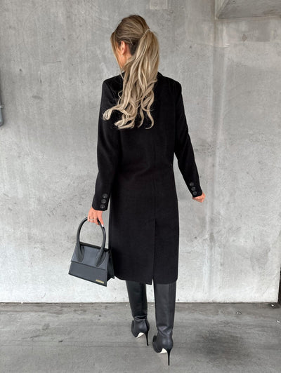 Classic women's long coat with elegant buttons and lapels