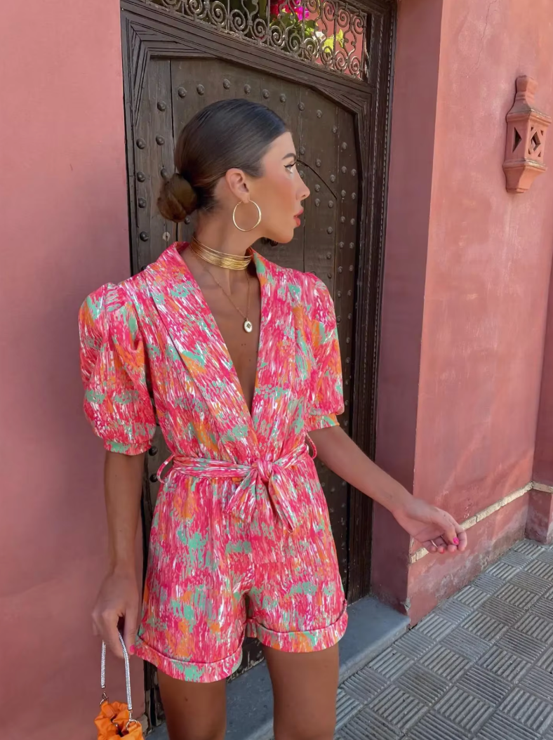 Modern short jumpsuit with a plunging neckline and fresh style