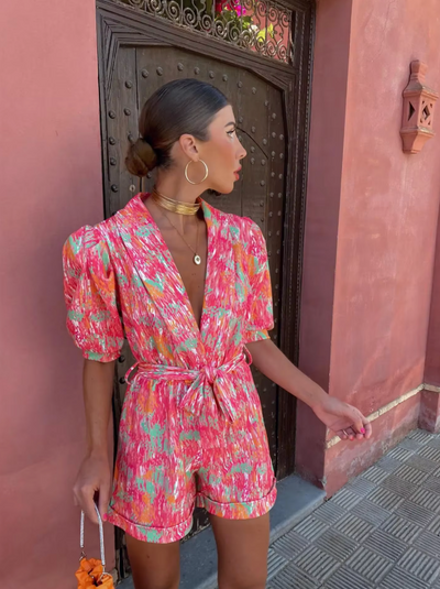 Modern short jumpsuit with a plunging neckline and fresh style