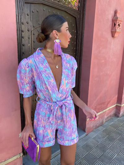Modern short jumpsuit with a plunging neckline and fresh style