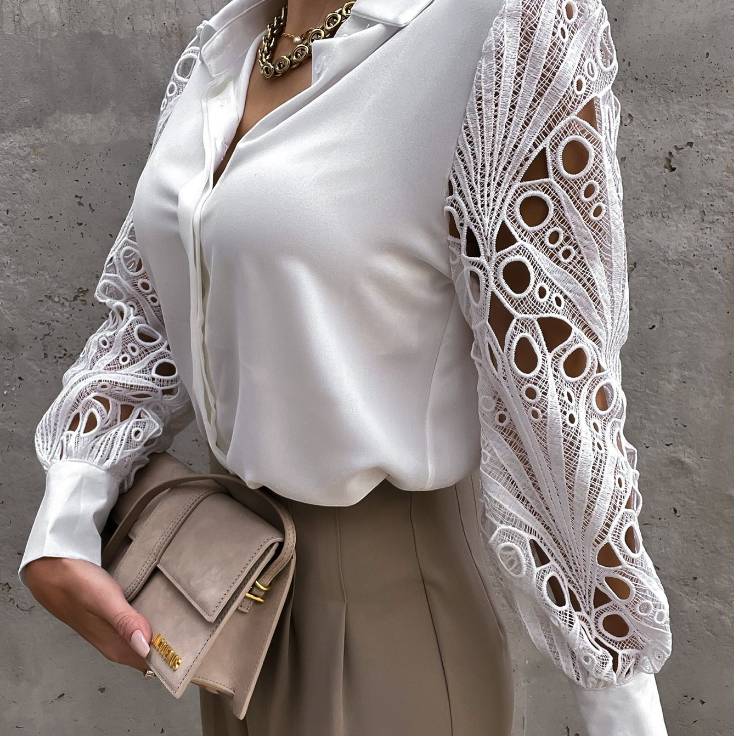 Feminine blouse with decorative long sleeves and elegant design