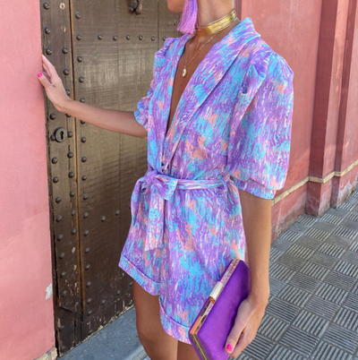 Modern short jumpsuit with a plunging neckline and fresh style