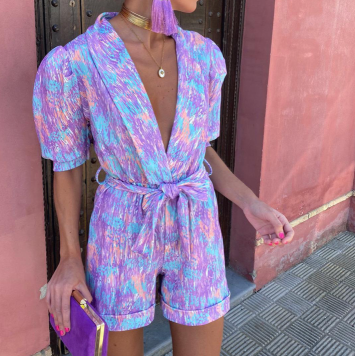 Modern short jumpsuit with a plunging neckline and fresh style