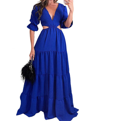Long summer dress with flared sleeves, a deep neckline, and a cut at the waist