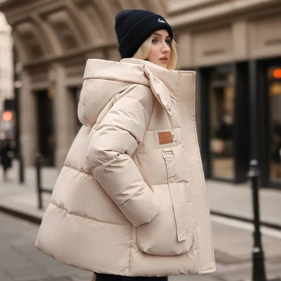 Modern women's coat with a wide hood and elegant design