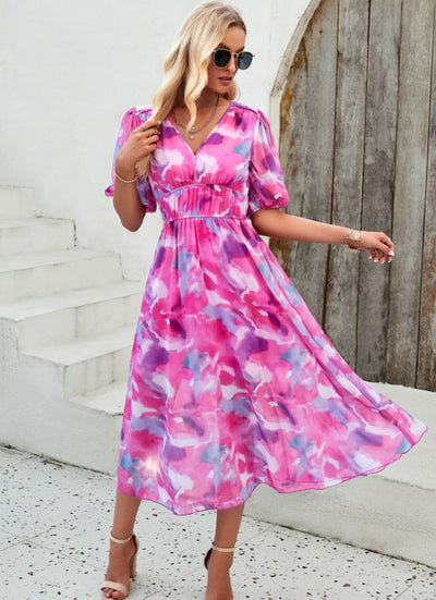 Elegant long dress with a V-neckline and subtle print