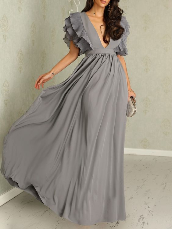 Sophisticated dress with detailed sleeves and elegant design for special occasions