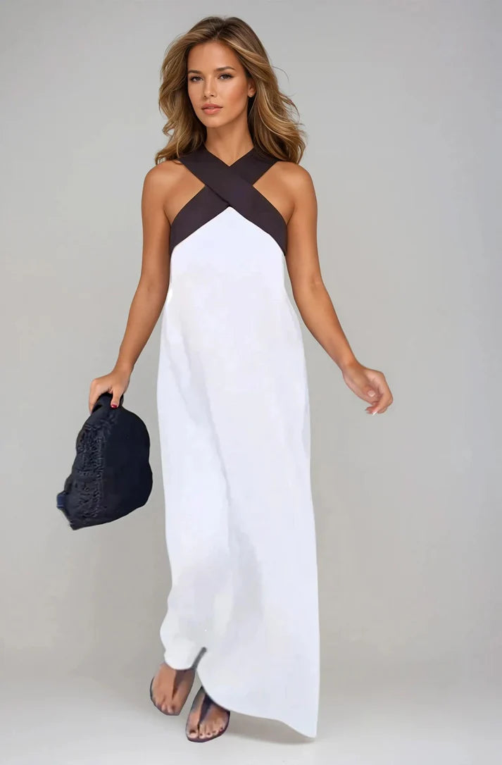 Long sleeveless dress with elegant neckline and modern cut
