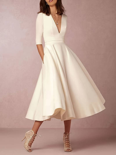 Elegant midi party dress with medium sleeves and flared cut