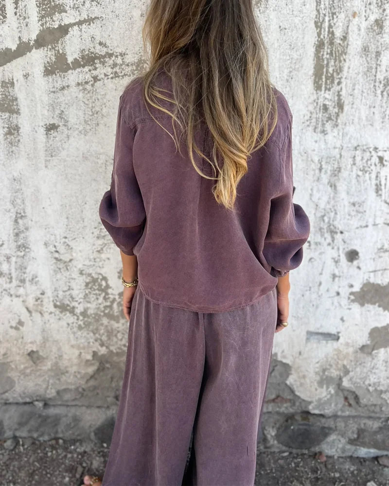 Light summer outfit with a long-sleeved button-down shirt and wide-legged pants