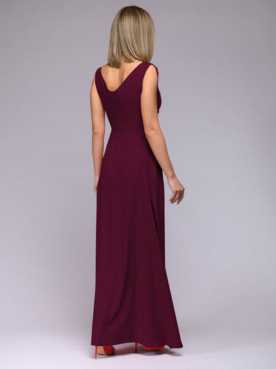 Long sleeveless evening dress with a plunging neckline and high slit