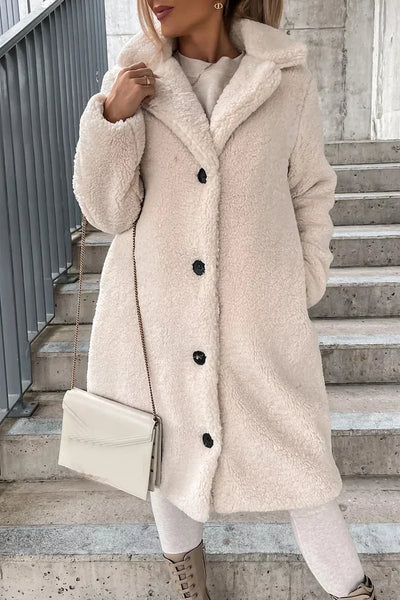 Warm women's coat with a large collar and lapels, long sleeves, ideal for cold days