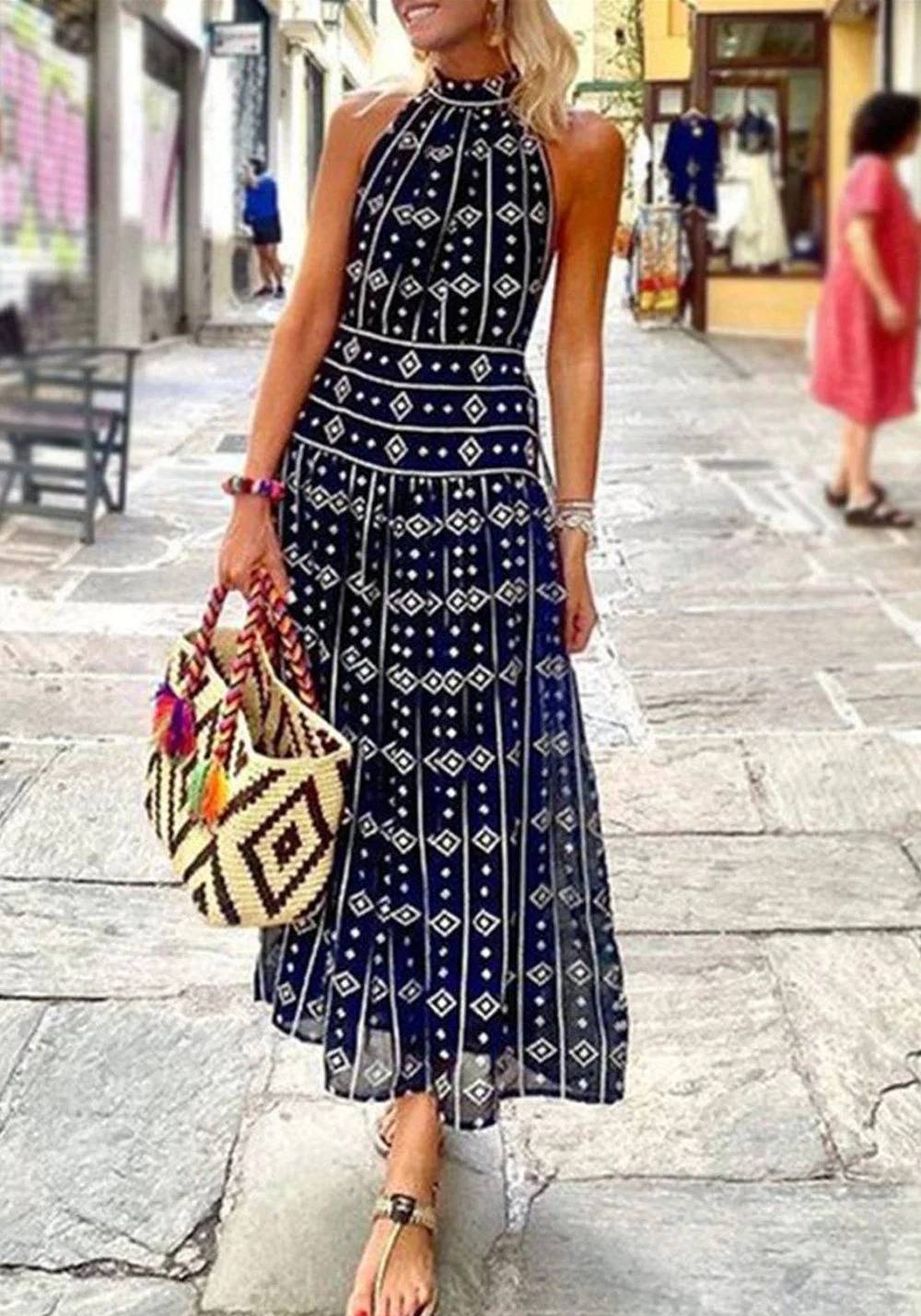 Frida - Sleeveless long dress with printed halter neck