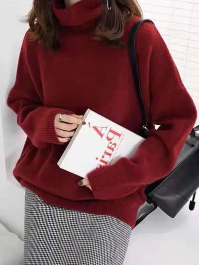 Elegant oversized sweater with long sleeves and a high neck