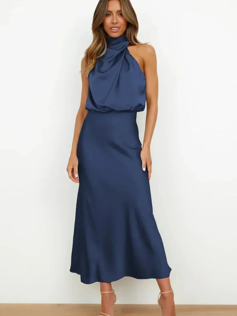 Long sleeveless dress with asymmetrical neckline and refined style