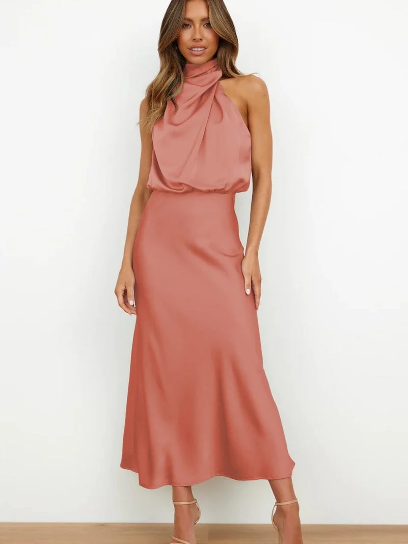 Long sleeveless dress with asymmetrical neckline and refined style