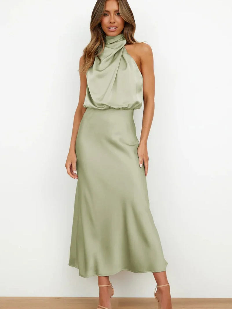 Long sleeveless dress with asymmetrical neckline and refined style