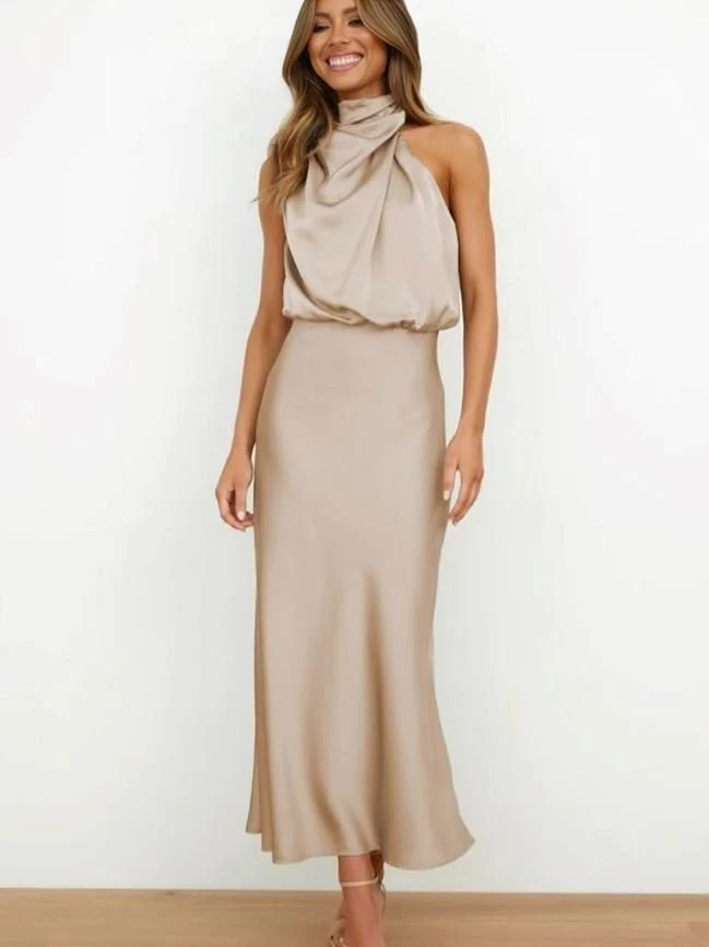 Long sleeveless dress with asymmetrical neckline and refined style