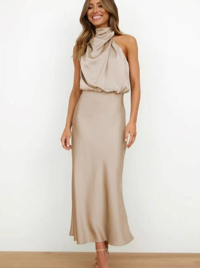 Long sleeveless dress with asymmetrical neckline and refined style
