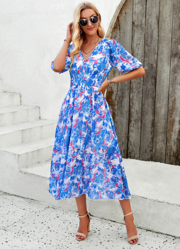 Elegant long dress with a V-neckline and subtle print