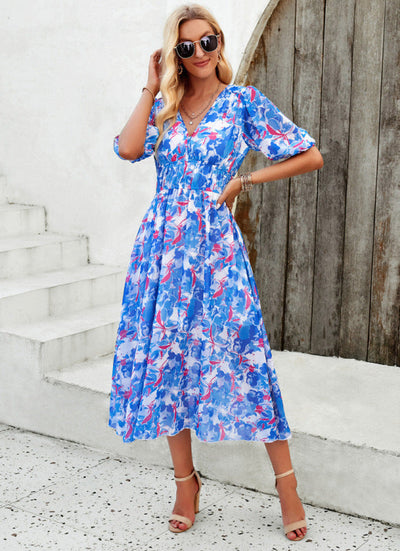 Elegant long dress with a V-neckline and subtle print