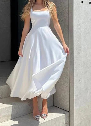 Elegant midi evening dress with straps and full skirt