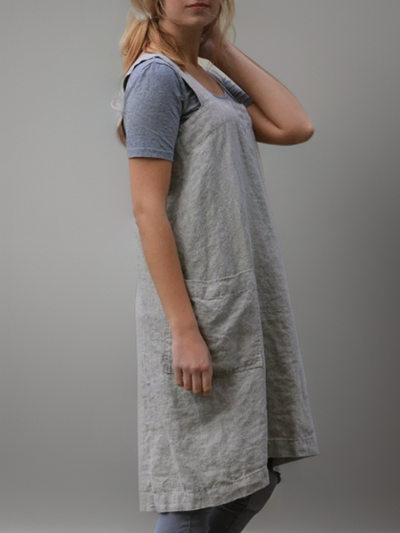Apron-style dress with practical pockets and functional design