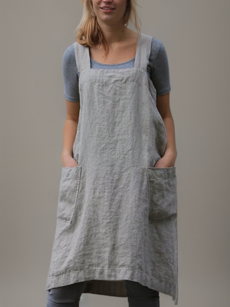 Apron-style dress with practical pockets and functional design