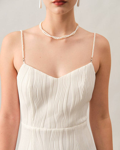 Elegant midi dress with thin straps and delicate texture