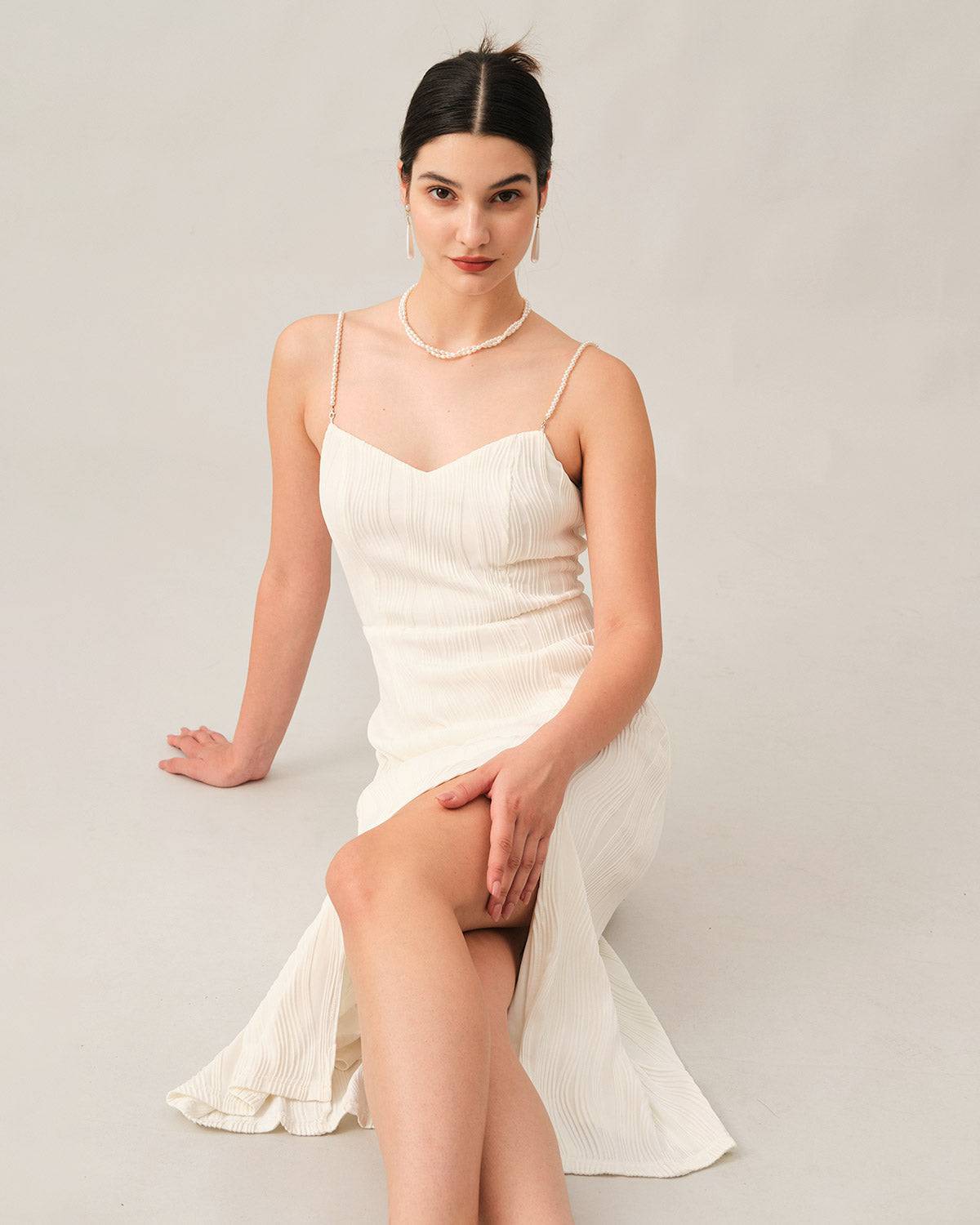 Elegant midi dress with thin straps and delicate texture