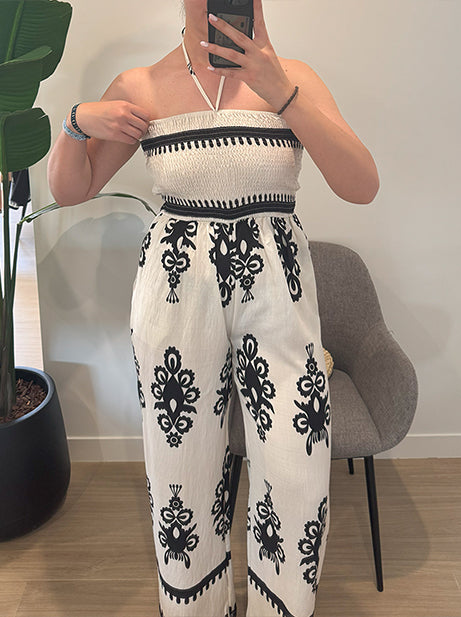 Women's wide-cut jumpsuit with a neck strap and printed trousers