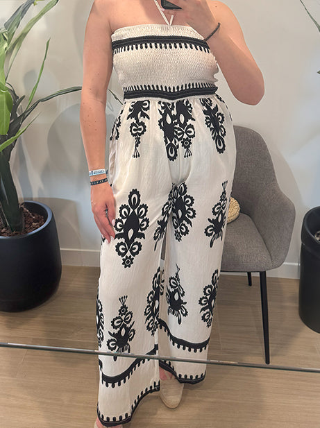 Women's wide-cut jumpsuit with a neck strap and printed trousers