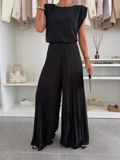 Modern set of sleeveless top and pleated wide-leg pants