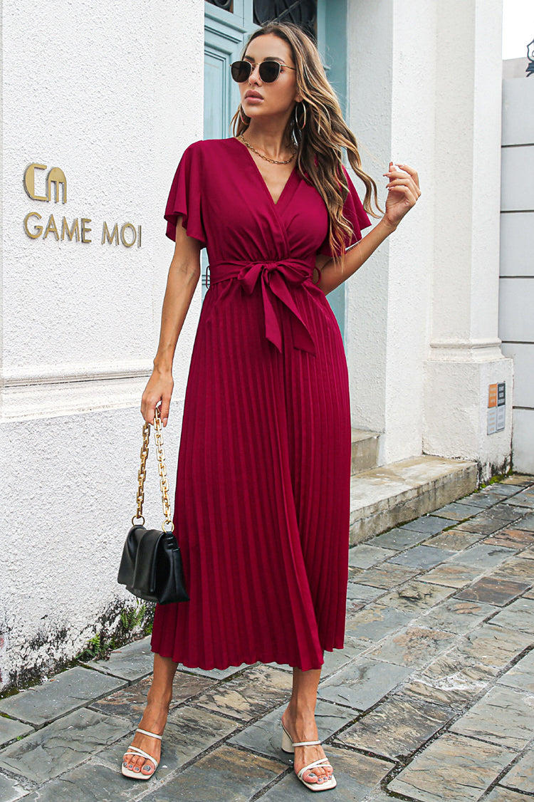Long pleated dress with short wide sleeves and fitted belt