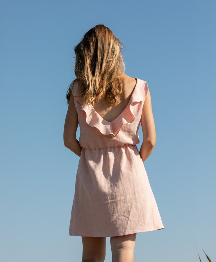 Elegant sleeveless mini dress with a V-neckline at the back