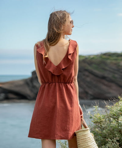 Elegant sleeveless mini dress with a V-neckline at the back