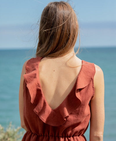 Elegant sleeveless mini dress with a V-neckline at the back