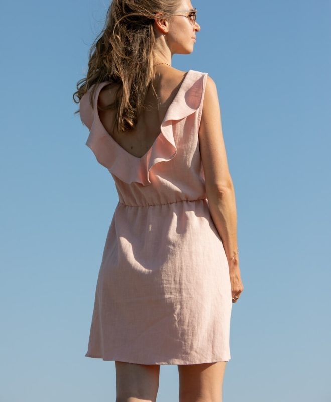 Elegant sleeveless mini dress with a V-neckline at the back