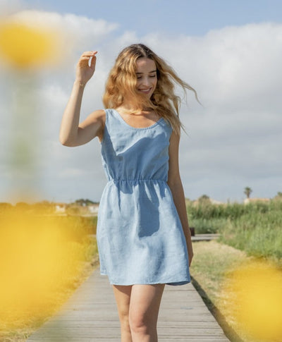 Elegant sleeveless mini dress with a V-neckline at the back