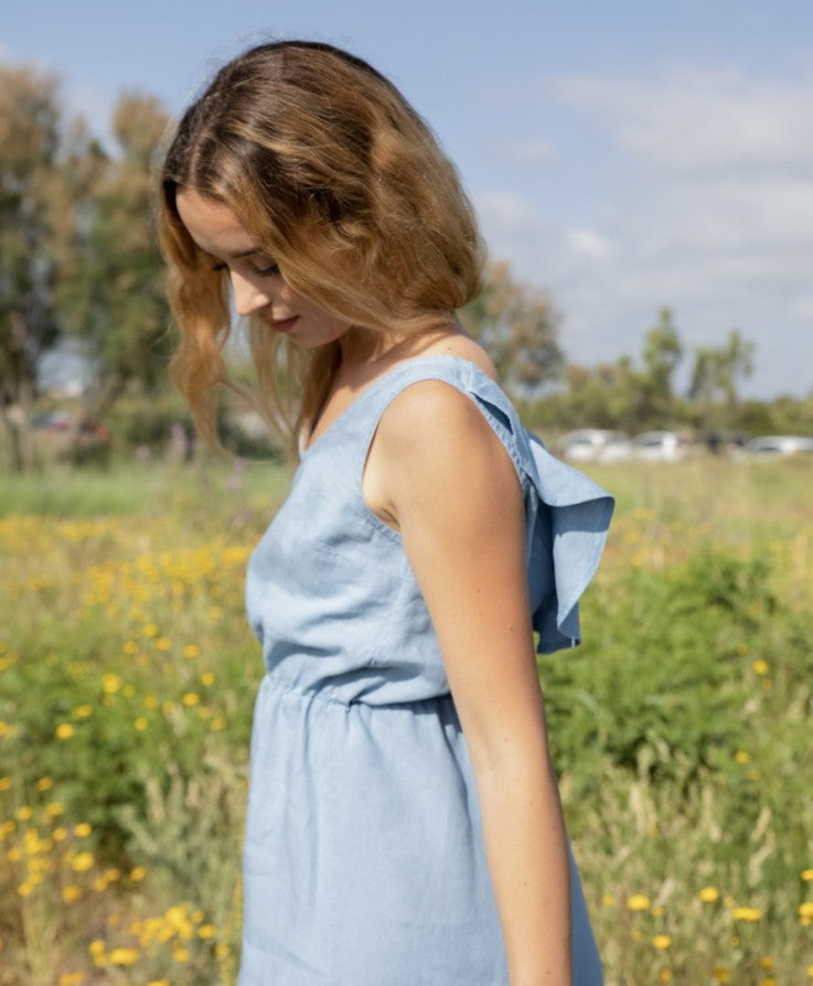 Elegant sleeveless mini dress with a V-neckline at the back