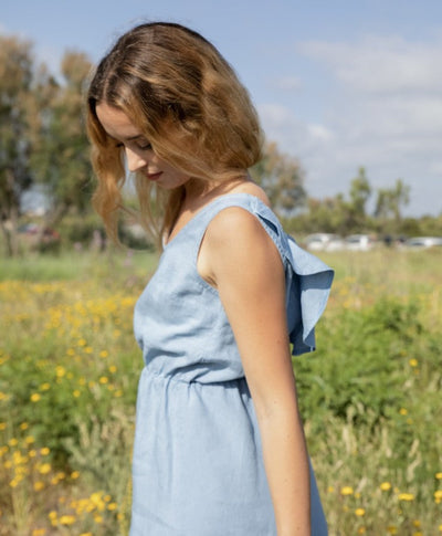 Elegant sleeveless mini dress with a V-neckline at the back