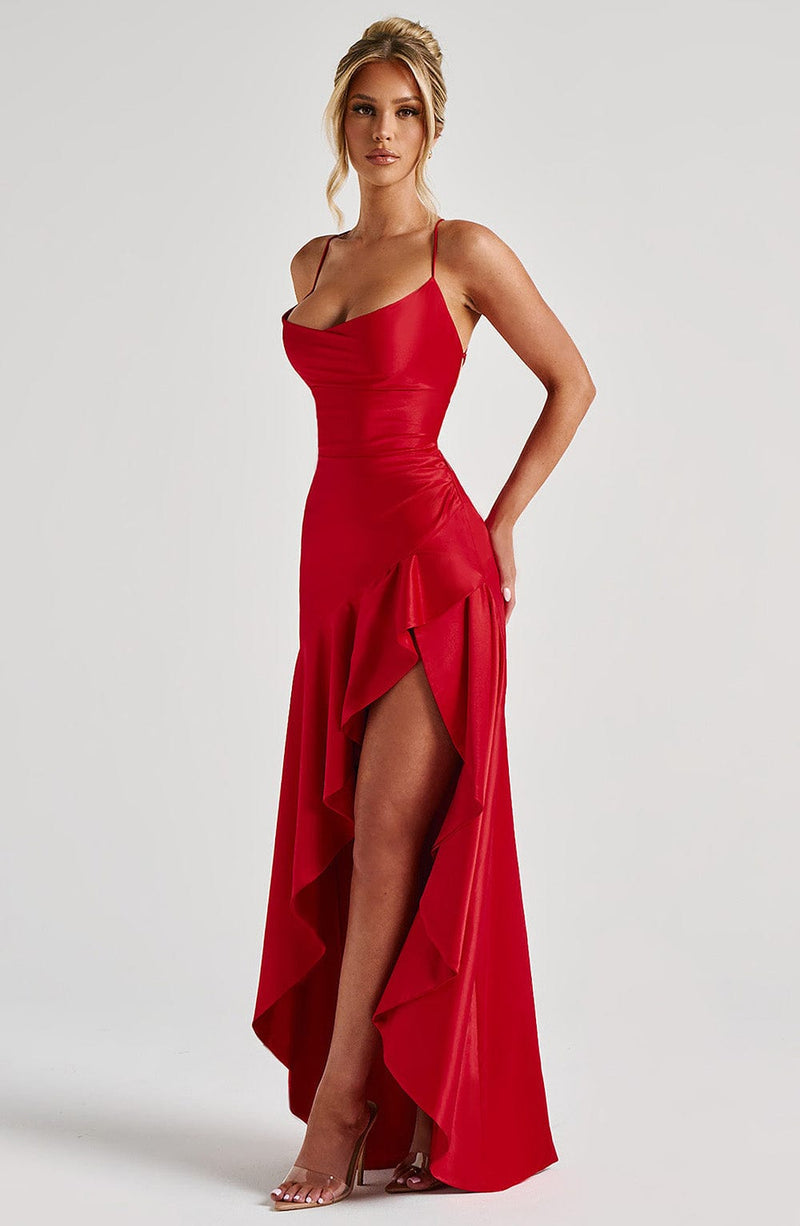 Long evening dress with thin straps, high slit, and asymmetrical hem