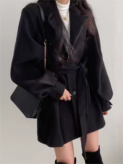 Women's coat with lapel collar, puff sleeves and belt