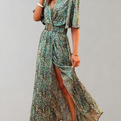 Long flowing dress with a deep neckline and wide sleeves